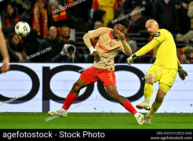 Elye Wahi (9) of RC Lens fighting for the ball with goalkeeper Marko Dmitrovic (1) of Sevilla during the Uefa Champions League matchday 6 game in group B in the...