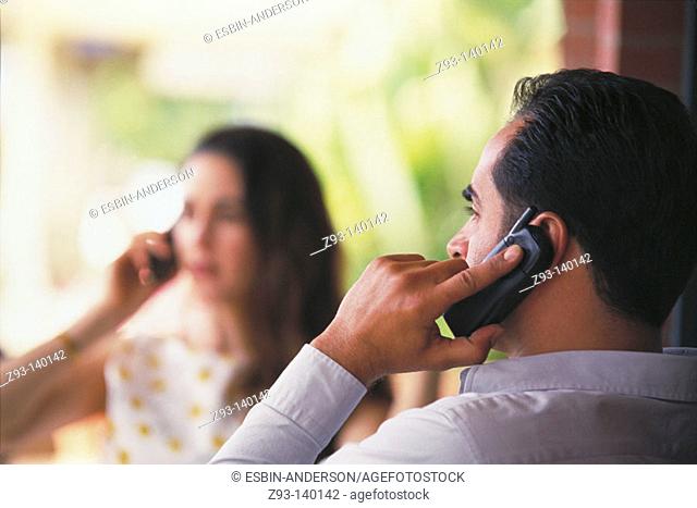 Couple talking on cell phones