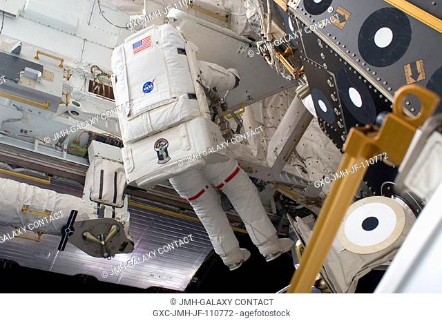 Astronaut Randy Bresnik, STS-129 mission specialist, performs a task on the exterior of the International Space Station during the second space walk of the...