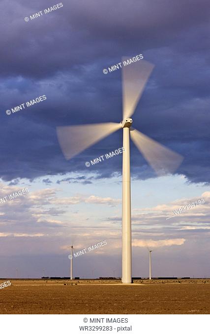 Wind Turbine Spinning at Dusk