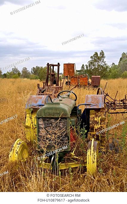 water vintage old tractor machinery abandoned in