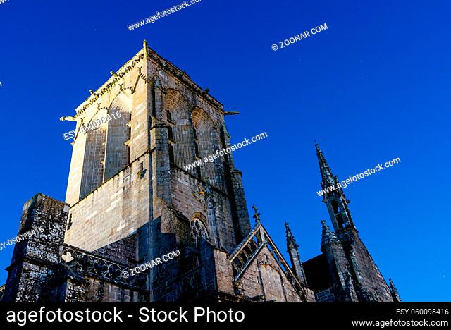 Close up detail of the facade of the churh of Saint Ronan in Locronan against blue sky