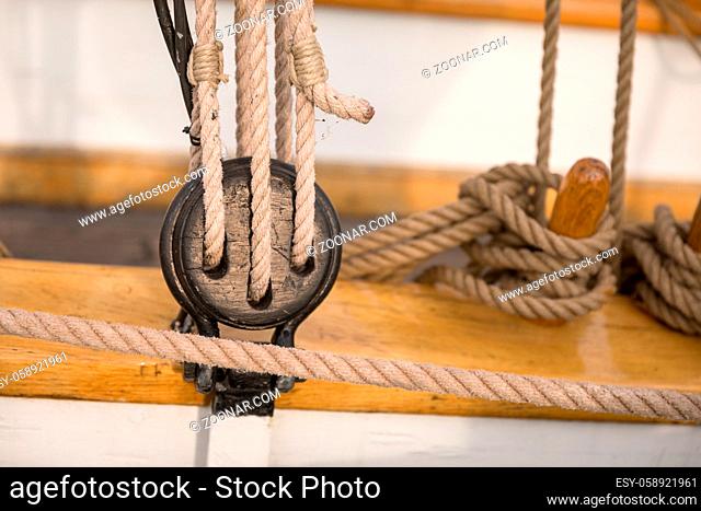 Pulley for sails and ropes made from wood on an old sail boat