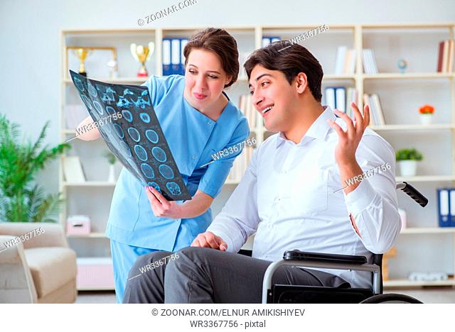 Doctor discussing x-ray image with patient