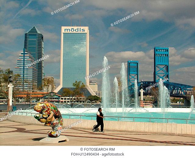Jacksonville, FL, Florida, downtown skyline, Main Street Bridge spans the St. Johns River, fountain at Riverwalk, Sea-Lection Manatee fiberglass statue