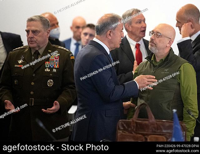 26 April 2022, Rhineland-Palatinate, Ramstein: Oleksiy Resnikov (r), defense minister of Ukraine, greets Hulusi Akar (m), defense minister of Turkey