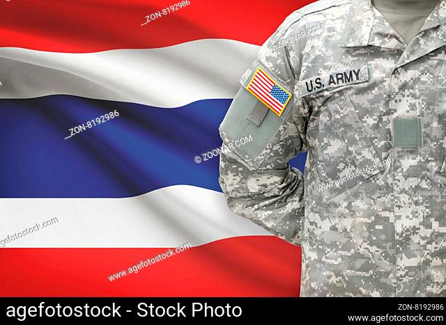 American soldier with flag on background - Thailand