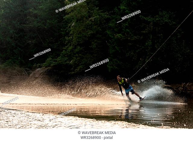 Man wakeboarding in the river