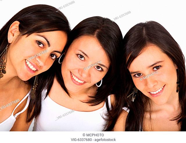 female friends smiling and dressed in white clothes isolated - 03/04/2007
