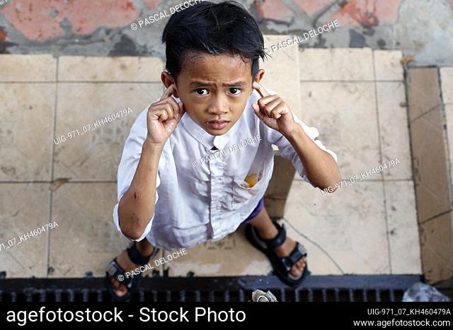 Nurunnaim mosque. Ritual purity in Islam. Muslim boy performing Wudu ( ablution ). Phnom Penh. Cambodia