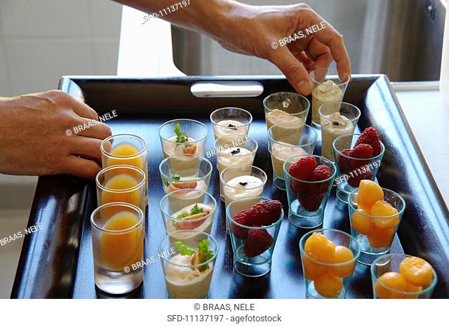 Mini dessert glasses on a tray in French restaurant La Table des Cordeliers run by Michelin starred chef Eric Sampietro