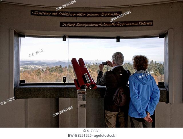 couple on Asten Tower enjoying a good view, Germany, North Rhine-Westphalia, Sauerland, Winterberg