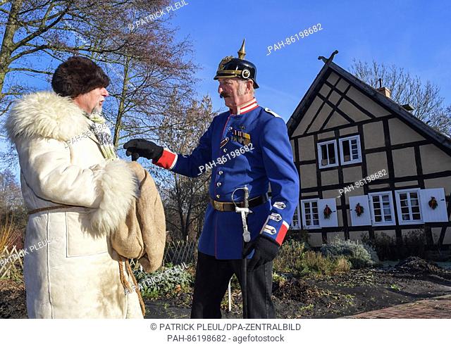 The Rumpodich (1), the Ruprecht servant of the Spreewald, and the country constable of Boblitz talking at the Christmas market in the open-air town museum of...