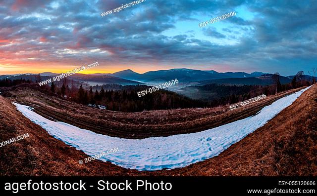 Morning sunrise spring Carpathian mountains plateau landscape with snow-covered ridge tops in far, Ukraine