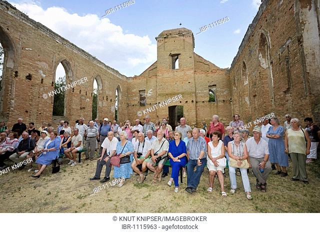 German tourists visiting the ruins of a Protestant church in the formerly German inahbited Bessarabian village Lichtental, today's Swetlodolinskoje, Ukraine