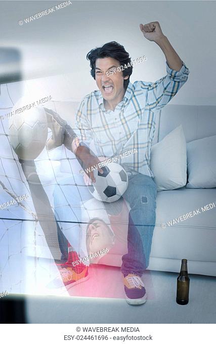 Composite image of happy man is watching sport on television