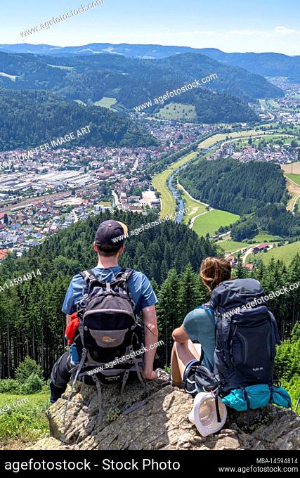 Europe, Germany, Southern Germany, Baden-Wuerttemberg, Black Forest, Hikers enjoy the view from Spitzfelsen over Hausach and the Kinzig valley