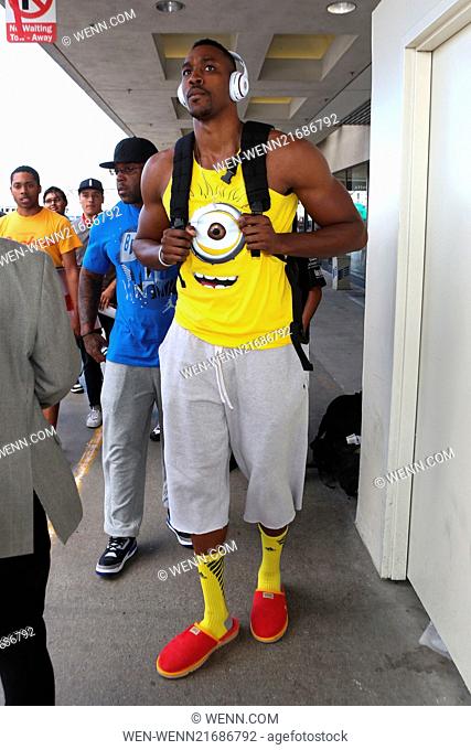 Dwight Howard, wearing a Ugg red slippers and a minion top, at Los Angeles International Airport (LAX) Featuring: Dwight Howard Where: Los Angeles, California