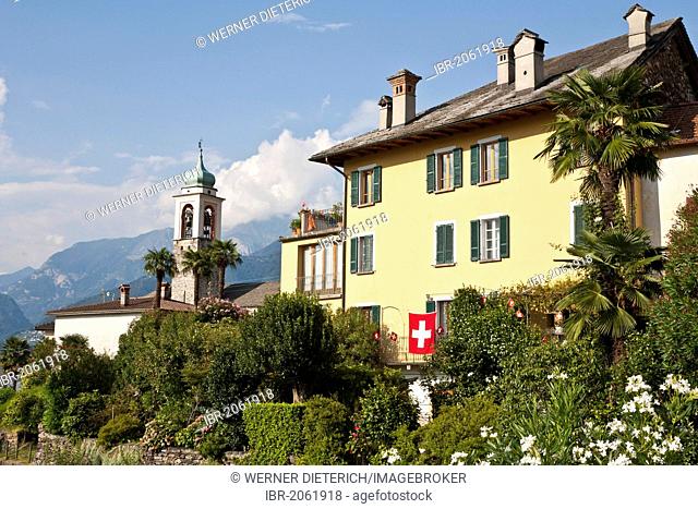Home in Vira on Lago Maggiore, Swiss flag, Gambarogno, Ticino, Switzerland, Europe