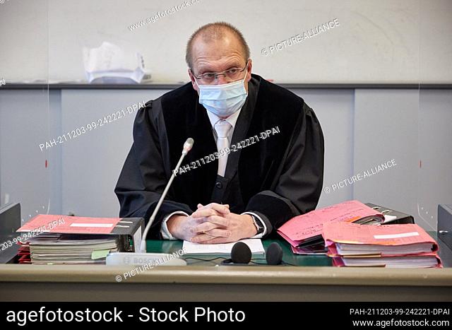 03 December 2021, Hamburg: Matthias Steinmann, presiding judge at the regional court, sits in the courtroom before the start of the trial of a 30-year-old man...