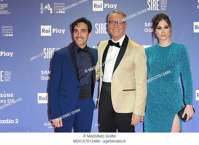 Italian actor and theater director Massimo Ghini and his children during the red carpet of the 64th edition of the David di Donatello