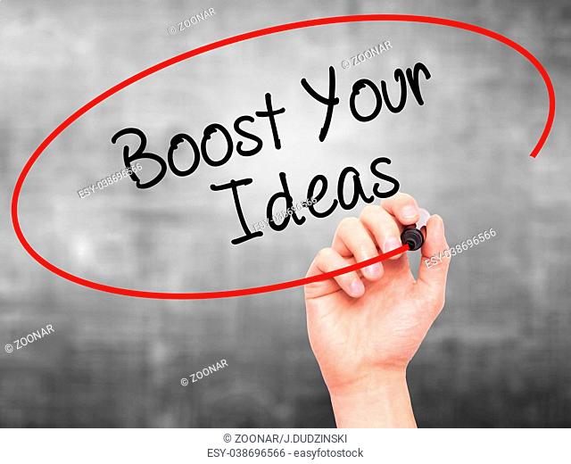 Man Hand writing Boost Your Ideas with black marker on visual screen