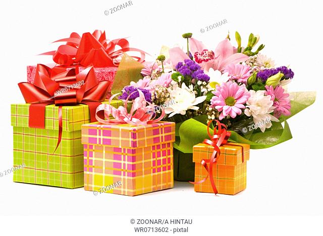Magnificent bouquet and present boxes on a white
