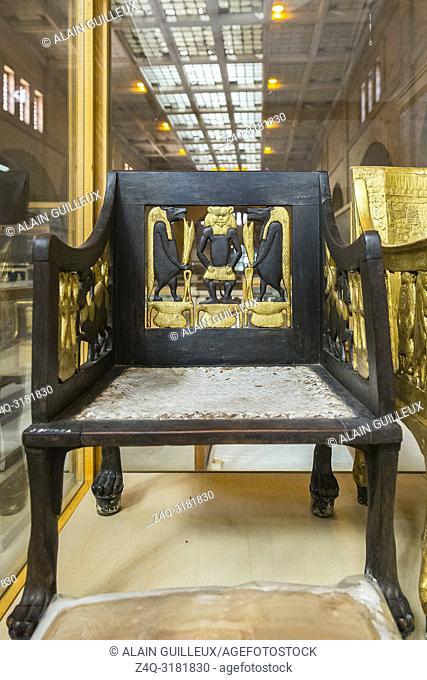 Egypt, Cairo, Egyptian Museum, from the tomb of Yuya and Thuya in Luxor : Wooden chair, painted and gilded. The feet are lion paws, in silver