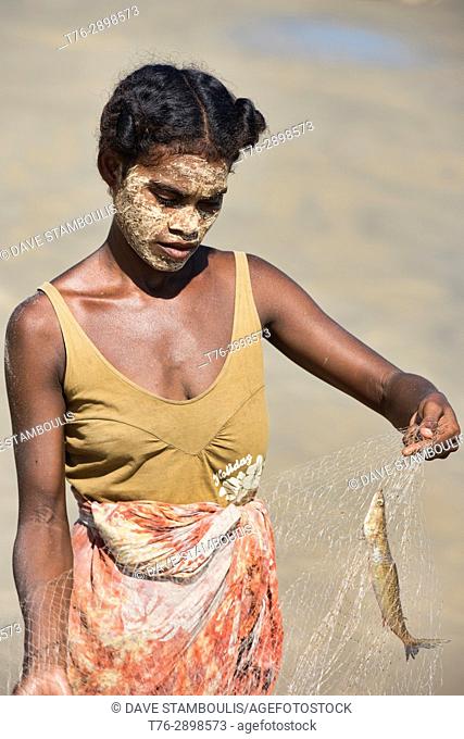 Sakalava woman working the fish nets, Morondava, Madagascar
