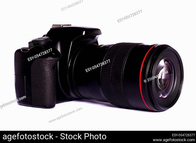 Close view of a modern photographic DSLR camera isolated on a white background