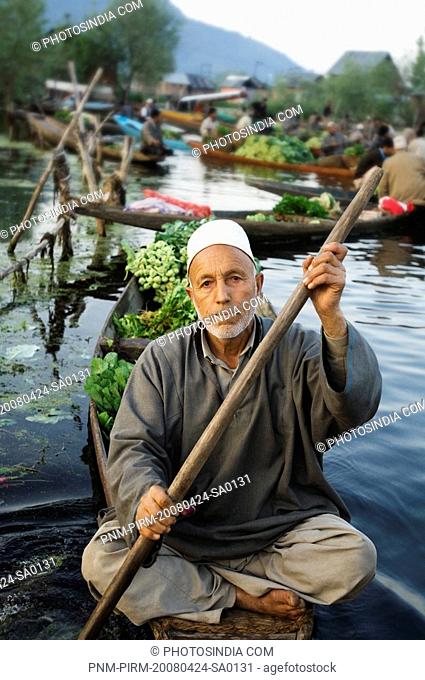 Man selling vegetables in a boat, Dal Lake, Srinagar, Jammu And Kashmir, India