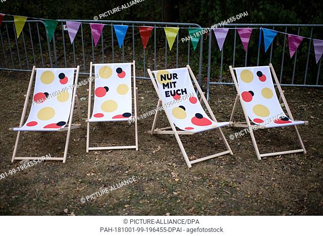 01 October 2018, Berlin: 01 October 2018, Germany, Berlin: Empty sun chairs stand on the Buergerfestmeile after the start of the celebrations for the Day of...