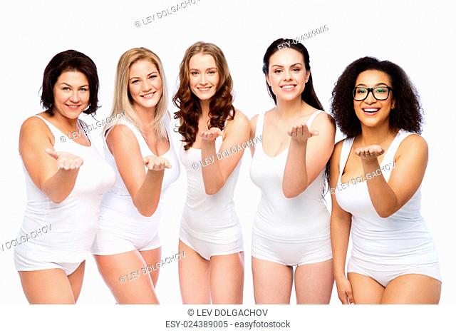 love, friendship, beauty, body positive and people concept - group of happy plus size women in white underwear sending blow kiss