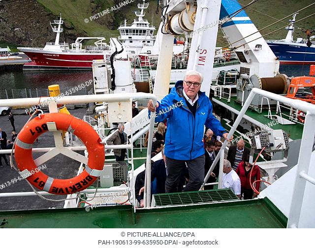 13 June 2019, Iceland, Westmännerinseln: Federal President Frank-Walter Steinmeier is going up a flight of stairs while visiting the Breki fishing trawler