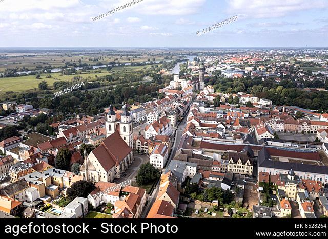 Drone shot, aerial view, drone photo, picture from above to the historic town church St. Marien over the market place and half-timbered houses to the castle...