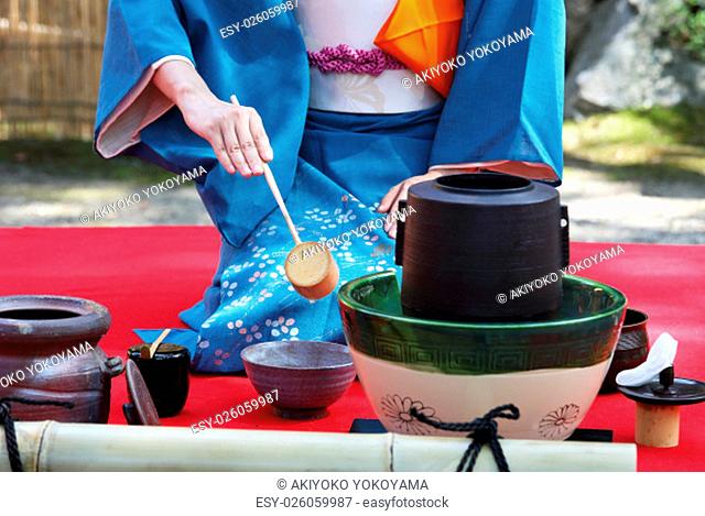 Japanese tea ceremony in garden, close up