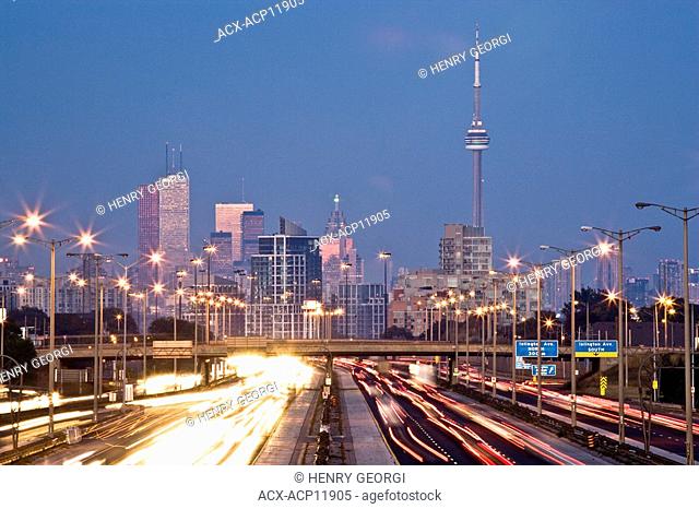 Rush-hour traffic on QEW Queen Elizabeth Way and Toronto city skyline, Toronto, Ontario, Canada