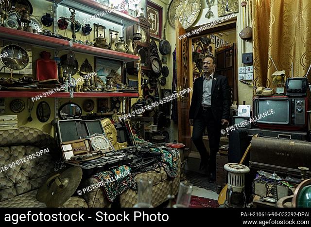 16 June 2021, Iraq, Mosul: Iraqi Fakhri Suleiman Al-Tai is seen at his house amongst artefacts and antique pieces that he collected after he returned to Mosul's...