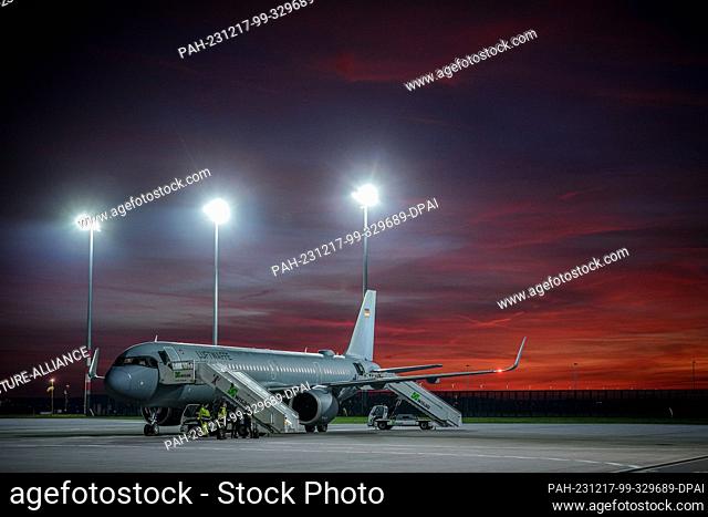17 December 2023, Lithuania, Vilnius: An Air Force Airbus A321 is waiting for the flight with the Minister of Defense at the military section of BER Airport for...