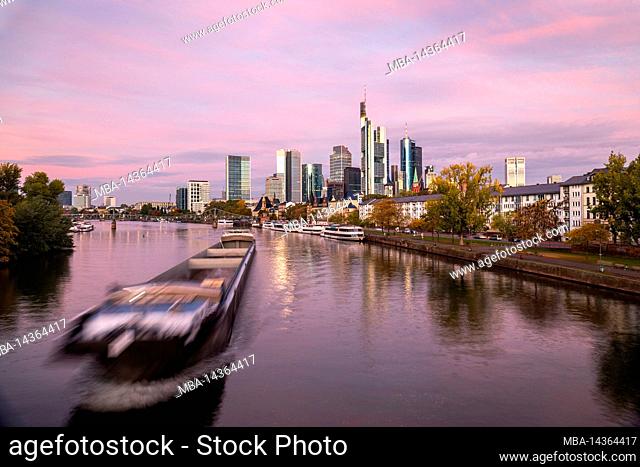 Germany, Hesse, Rhine-Main area, Frankfurt on the Main, shipping traffic on the Main, skyline in the early morning, view from the Old Bridge, long exposure