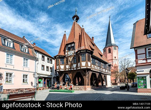 michelstadt, hessen, germany. the historic michelstadt town hall with easter decorations. in the background the city church