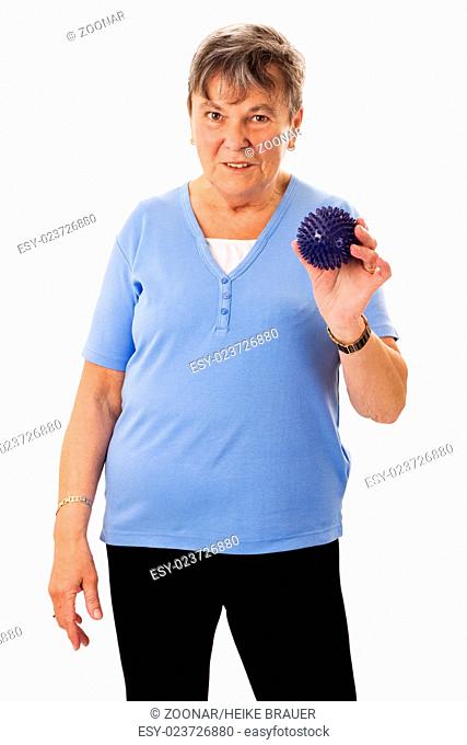 Senior woman with massage ball