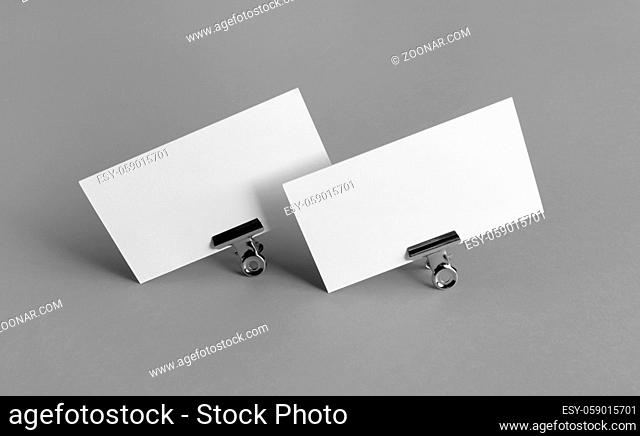 Blank business cards. Photo of blank white business cards on gray paper background. Mockup for branding identity. Corporate identity template