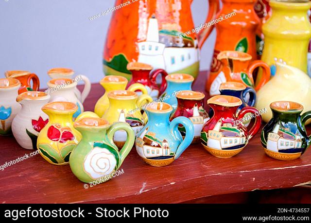 various colorful clay handmade craft jug jar sell in market