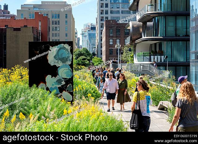 New York, United States of America - September 21, 2019: People stroll along the High Line Park in Manhattan. The urban park is popular by locals and tourists...