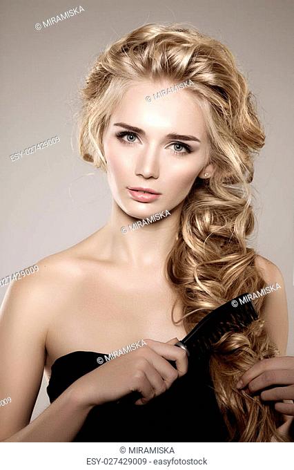 Model with long braided hair. Waves Curls Braid Hairstyle. Hair Salon.  Updo, Stock Photo, Picture And Low Budget Royalty Free Image. Pic.  ESY-027429009 | agefotostock