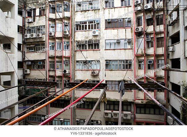 CHINA HONG KONG KOWLOON TSIM SHA TSUI NATHAN ROAD Postwar apartments in bad condition with noticeable the colored sticks that Chinese are using for drying...