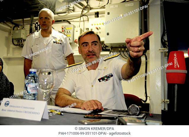 Counter admiral Enrico Credendino (R), commander of the ""Sophia"" EU mission, sitting aboard the mission's new flagship, the Spanish ship ""Cantabria""