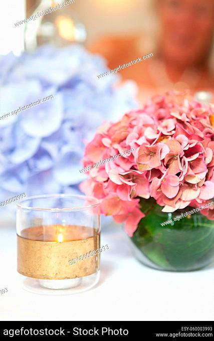 A beautiful multi-colored bouquet of hydrangeas on the table. Home comfort. High quality photo