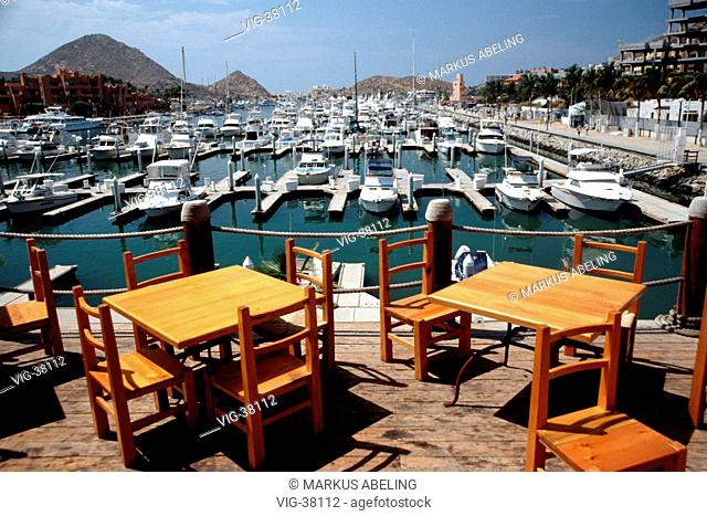 Empty terrace of a restaurant at the yacht harbour. - CABO SAN LUCAS, MEXICO, 09/09/2003